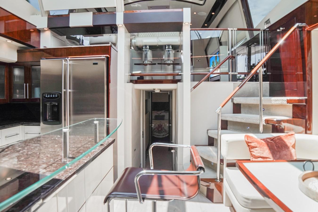 a room with a large glass window aboard LAZZARA 68' Yacht for Sale