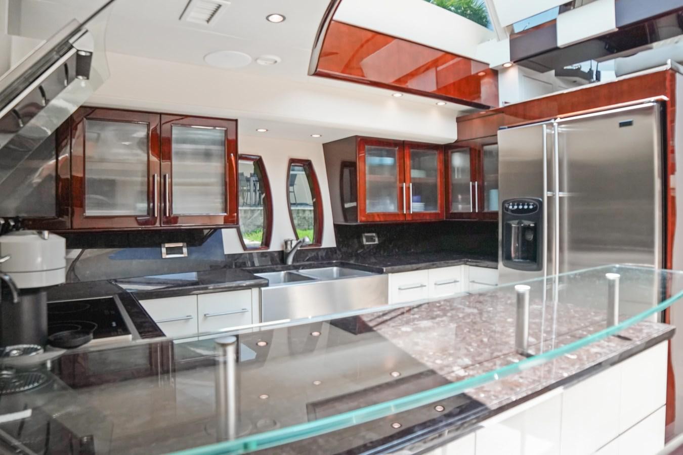 a kitchen with a large island aboard LAZZARA 68' Yacht for Sale