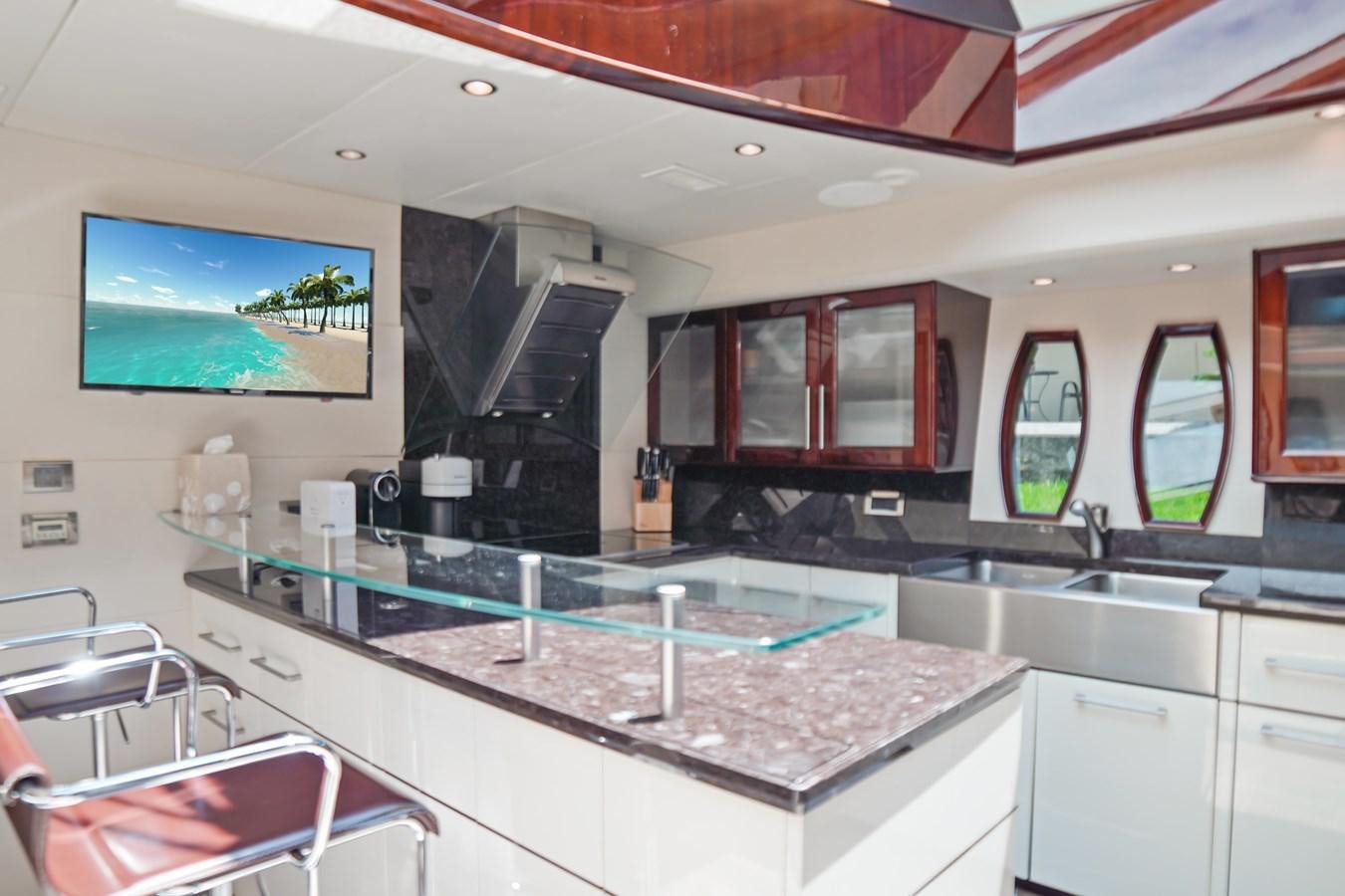 a kitchen with a large island aboard LAZZARA 68' Yacht for Sale