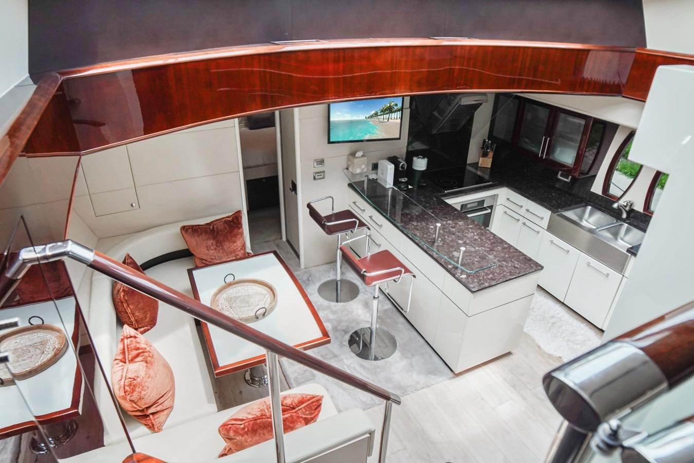 a kitchen with a bar and a bar aboard LAZZARA 68' Yacht for Sale