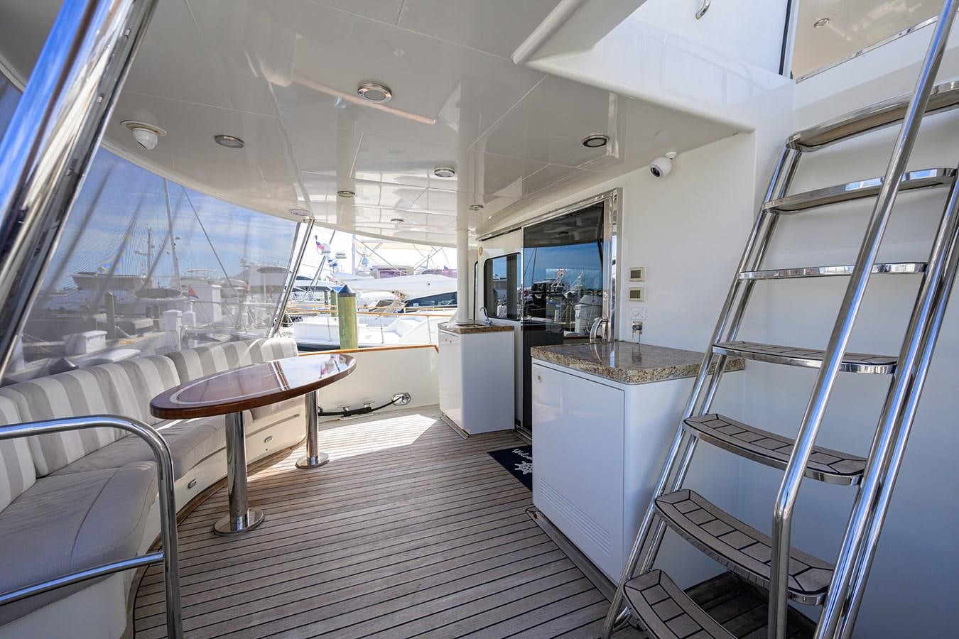 a boat with a table and chairs aboard ST. TROPEZ Yacht for Sale