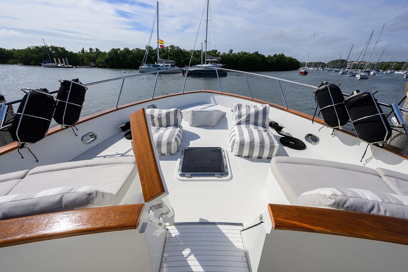 a boat is parked on the side of the water aboard ST. TROPEZ Yacht for Sale