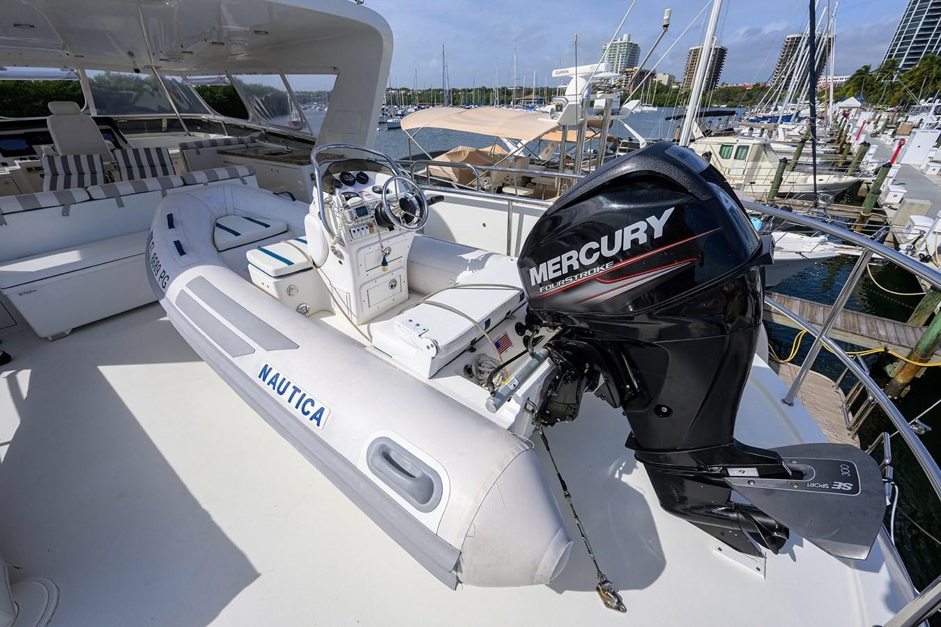 a white boat with a black cap aboard ST. TROPEZ Yacht for Sale