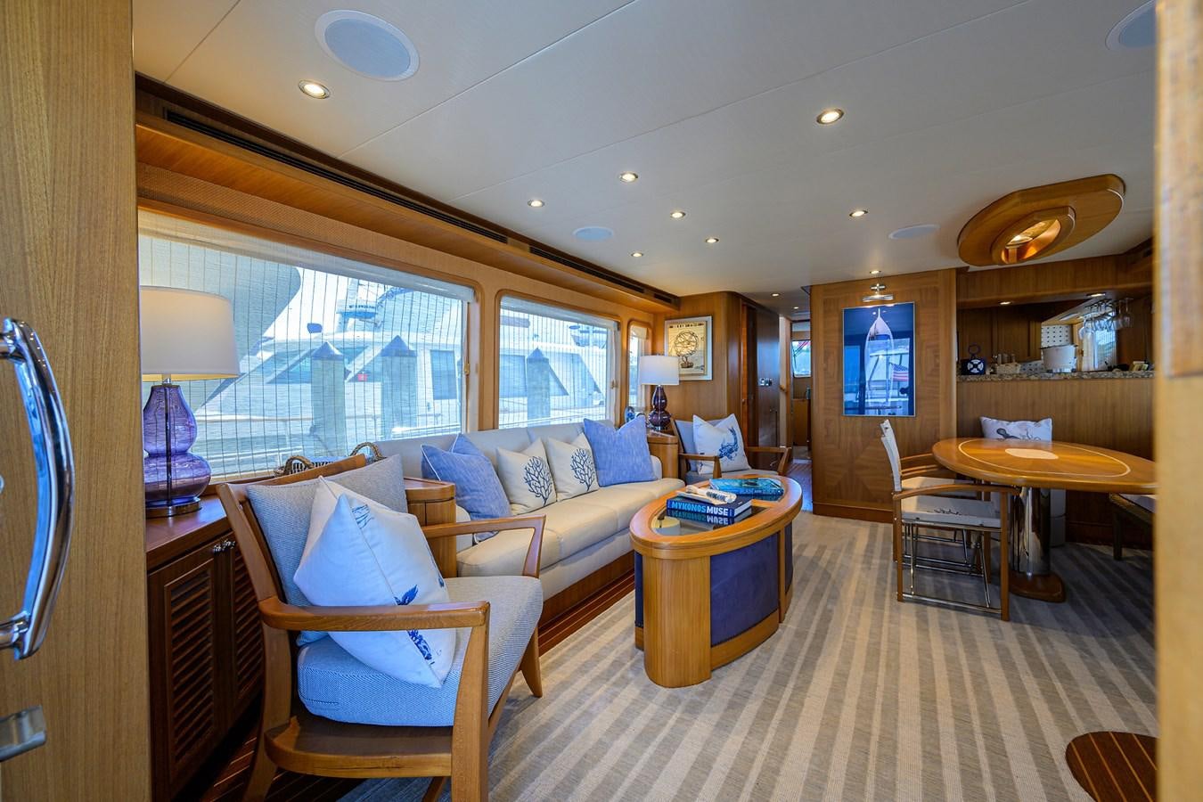 a living room with a couch and a table aboard ST. TROPEZ Yacht for Sale