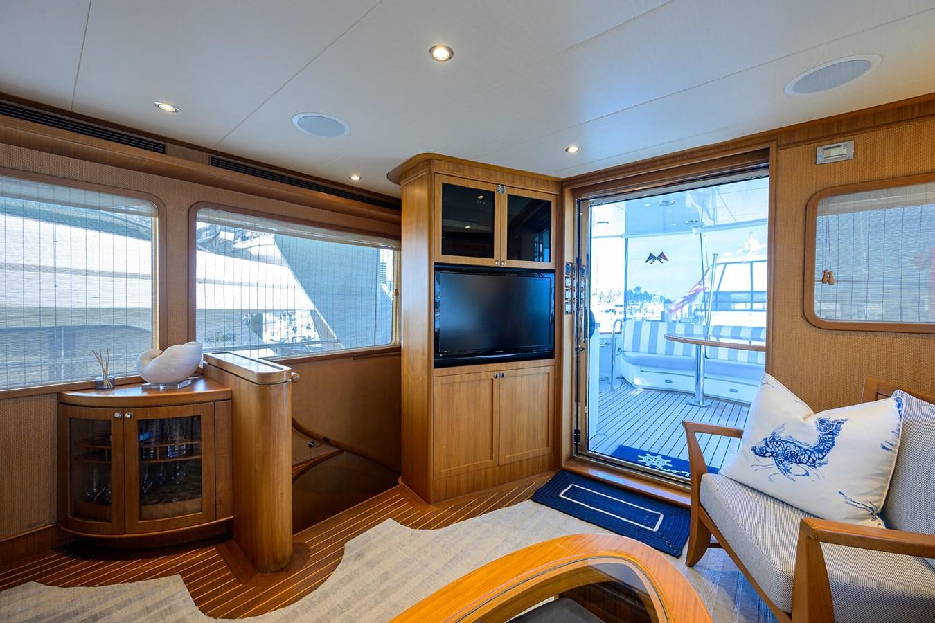 a living room with a tv and a couch aboard ST. TROPEZ Yacht for Sale
