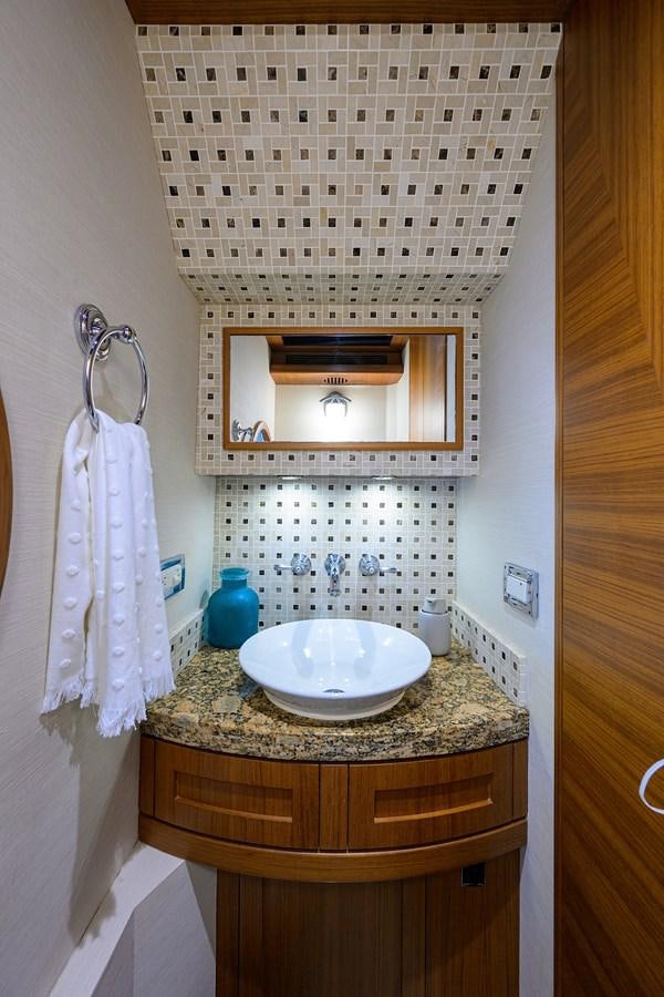 a bathroom with a sink and a mirror aboard ST. TROPEZ Yacht for Sale