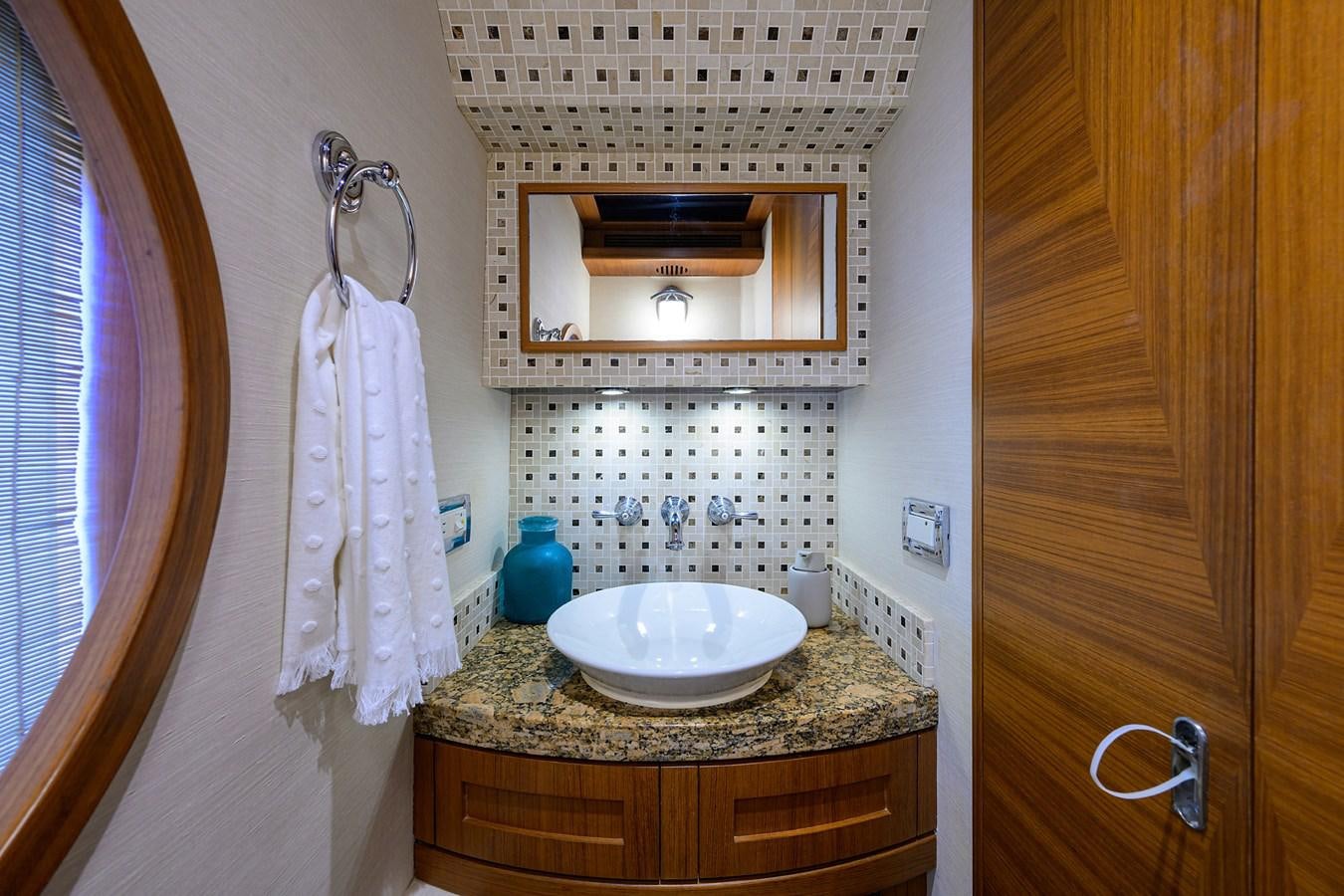 a bathroom with a sink and a mirror aboard ST. TROPEZ Yacht for Sale
