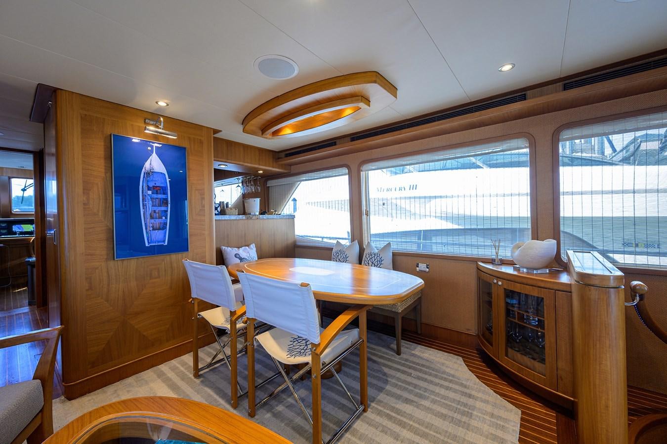 a room with a table and chairs aboard ST. TROPEZ Yacht for Sale