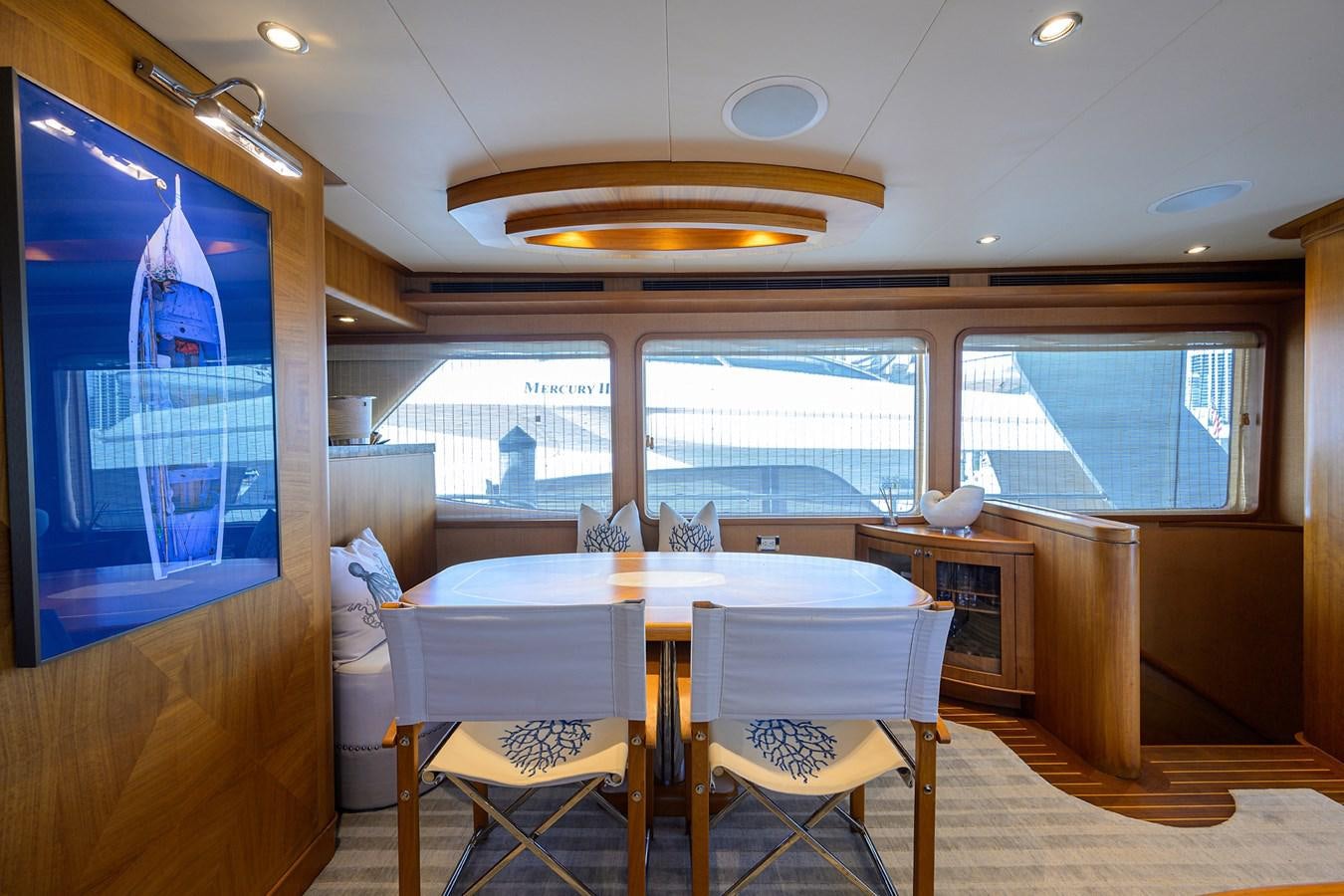 a room with a table and chairs aboard ST. TROPEZ Yacht for Sale