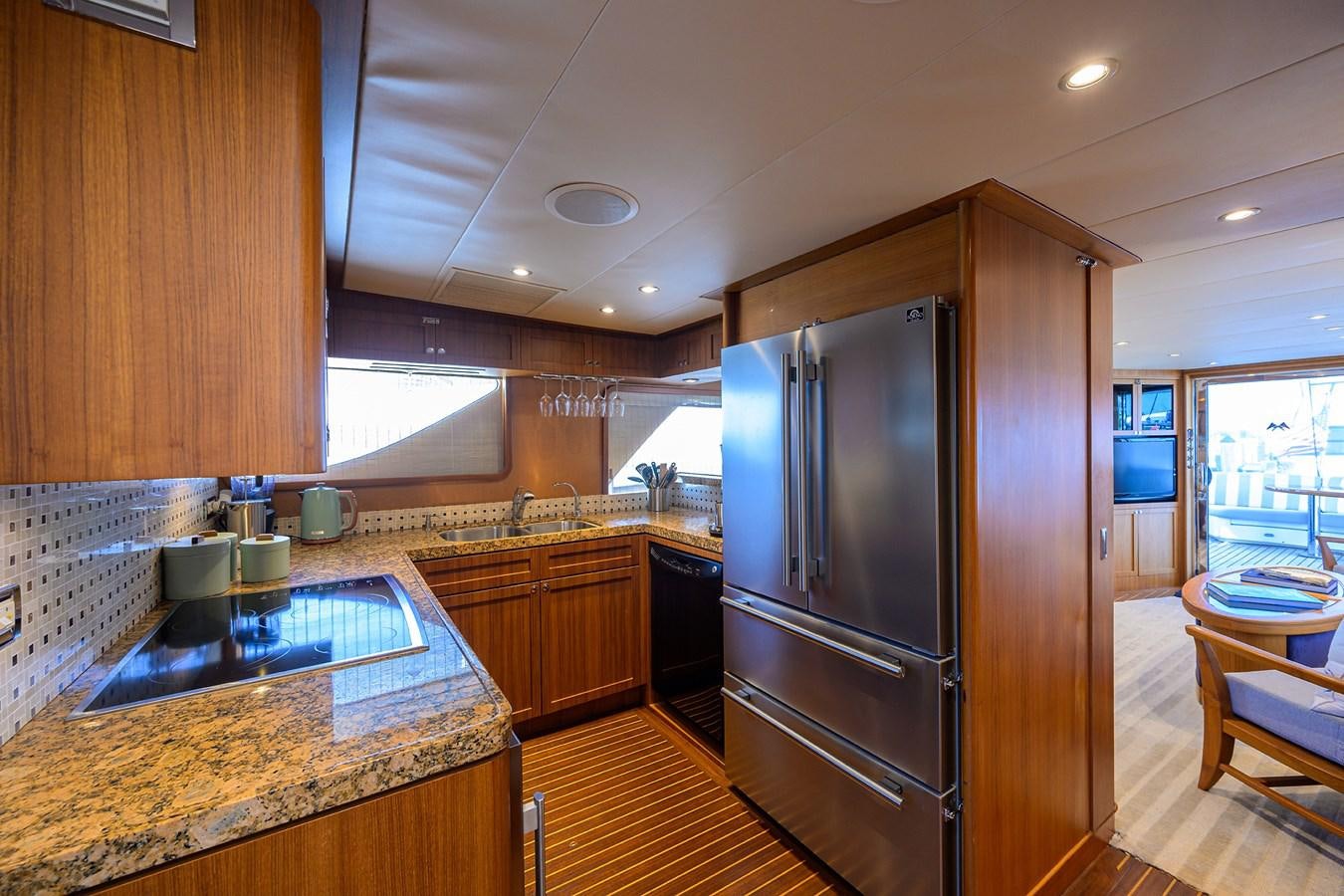 a kitchen with a stainless steel refrigerator aboard ST. TROPEZ Yacht for Sale