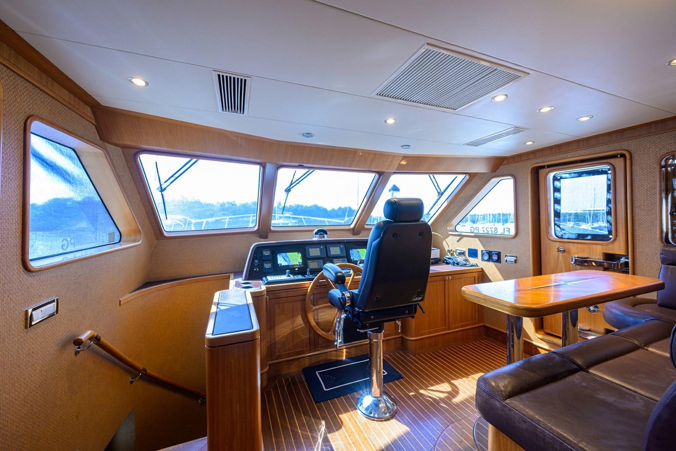 inside of a vehicle with a desk and chairs and a large window aboard ST. TROPEZ Yacht for Sale