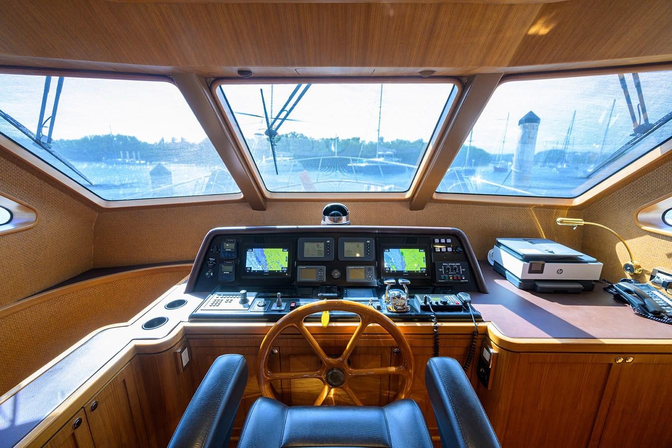 inside of a vehicle with a desk and a computer on the side aboard ST. TROPEZ Yacht for Sale