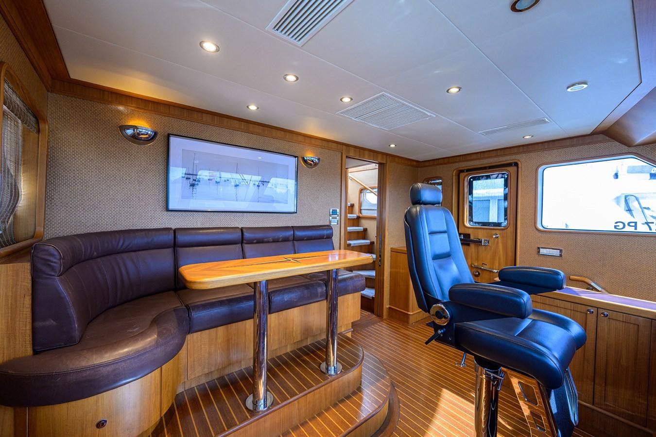 a living room with a couch and a table aboard ST. TROPEZ Yacht for Sale