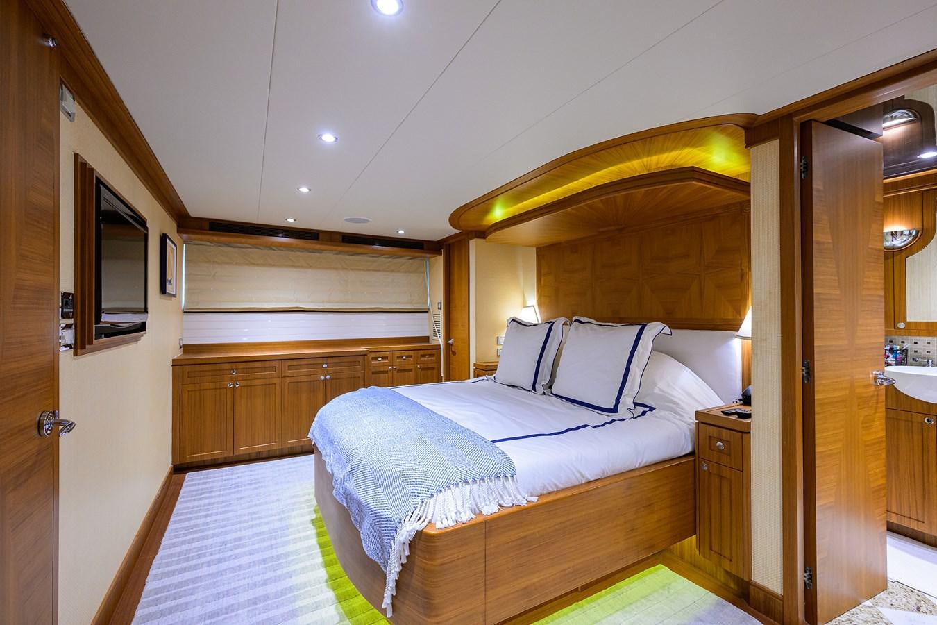 a bedroom with a bed aboard ST. TROPEZ Yacht for Sale