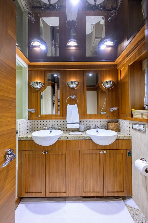a bathroom with a sink and a mirror aboard ST. TROPEZ Yacht for Sale