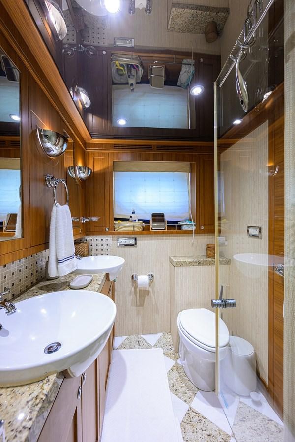 a bathroom with a sink toilet and a mirror aboard ST. TROPEZ Yacht for Sale
