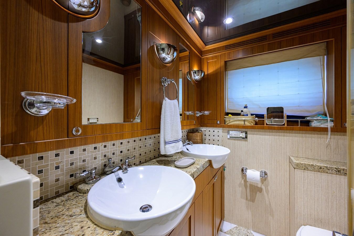 a bathroom with a sink and a mirror aboard ST. TROPEZ Yacht for Sale