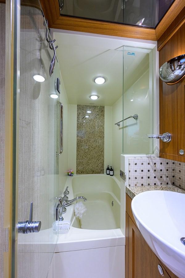 a bathroom with a sink and a shower aboard ST. TROPEZ Yacht for Sale