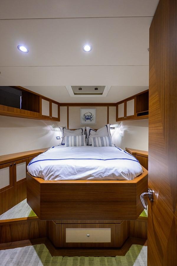 a bed with white sheets aboard ST. TROPEZ Yacht for Sale