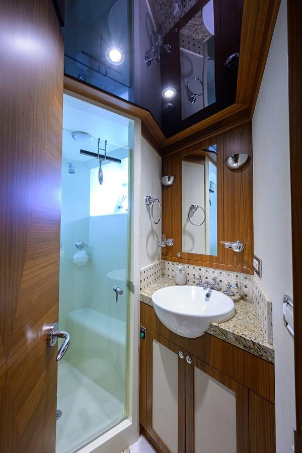 a bathroom with a glass shower door aboard ST. TROPEZ Yacht for Sale