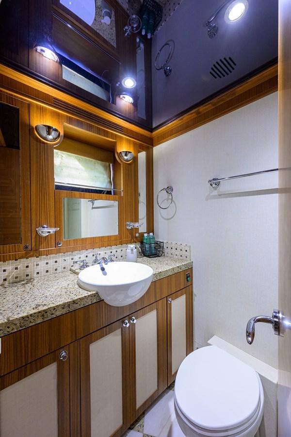 a bathroom with a sink and a mirror aboard ST. TROPEZ Yacht for Sale