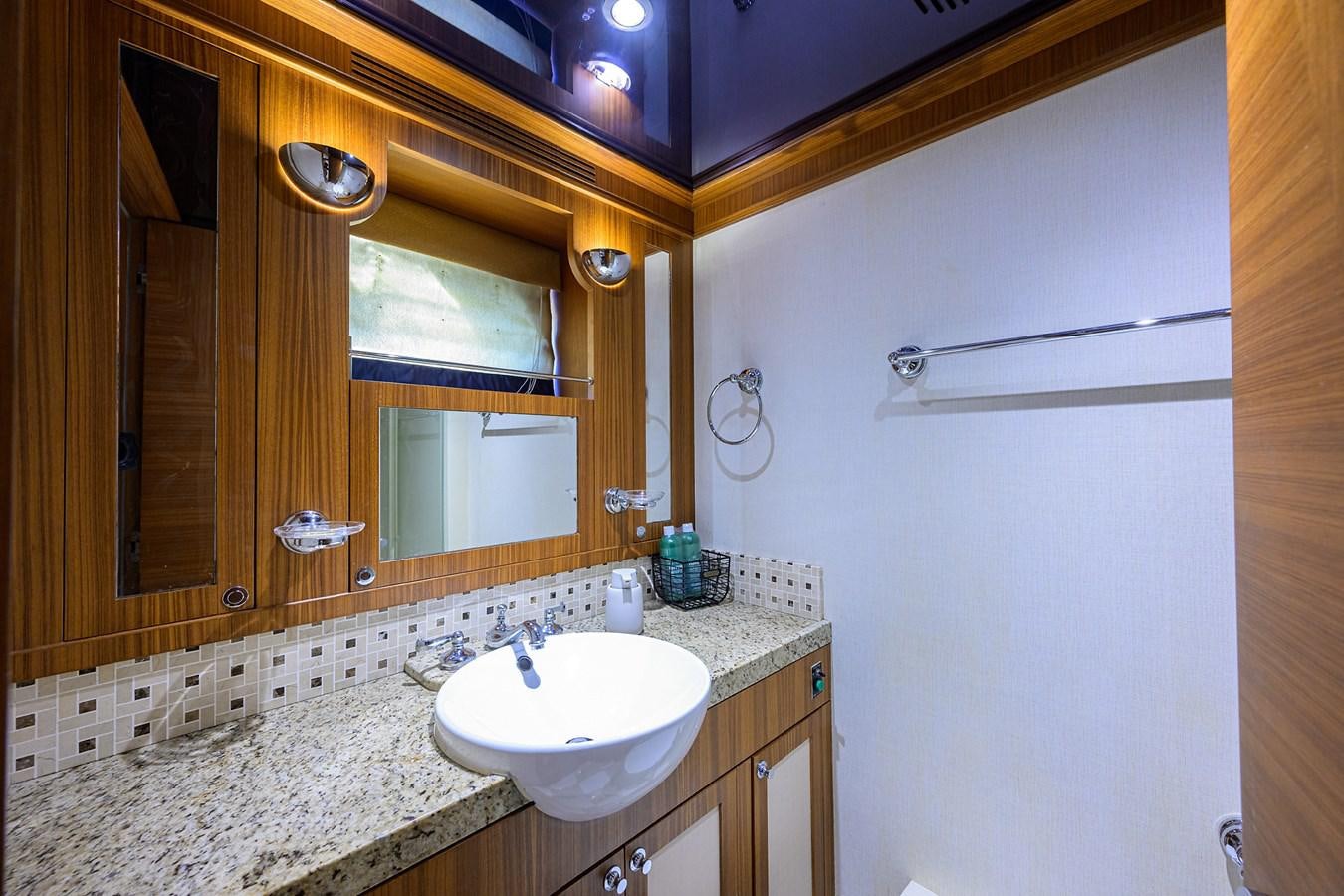 a bathroom with a sink and a mirror aboard ST. TROPEZ Yacht for Sale