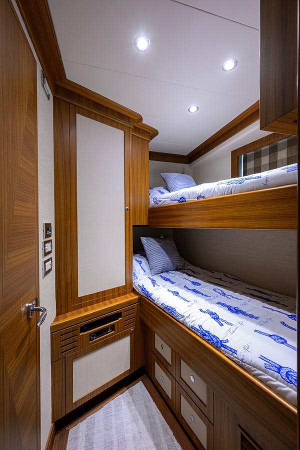 a room with a bed and a closet aboard ST. TROPEZ Yacht for Sale