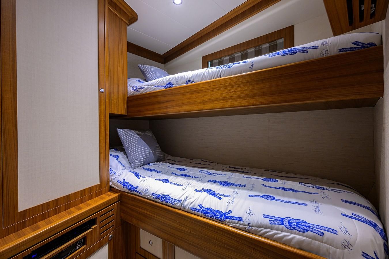 a bed with a blue sheet aboard ST. TROPEZ Yacht for Sale
