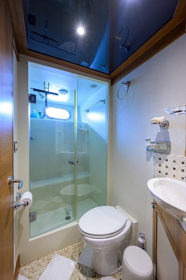 a bathroom with a glass shower door aboard ST. TROPEZ Yacht for Sale