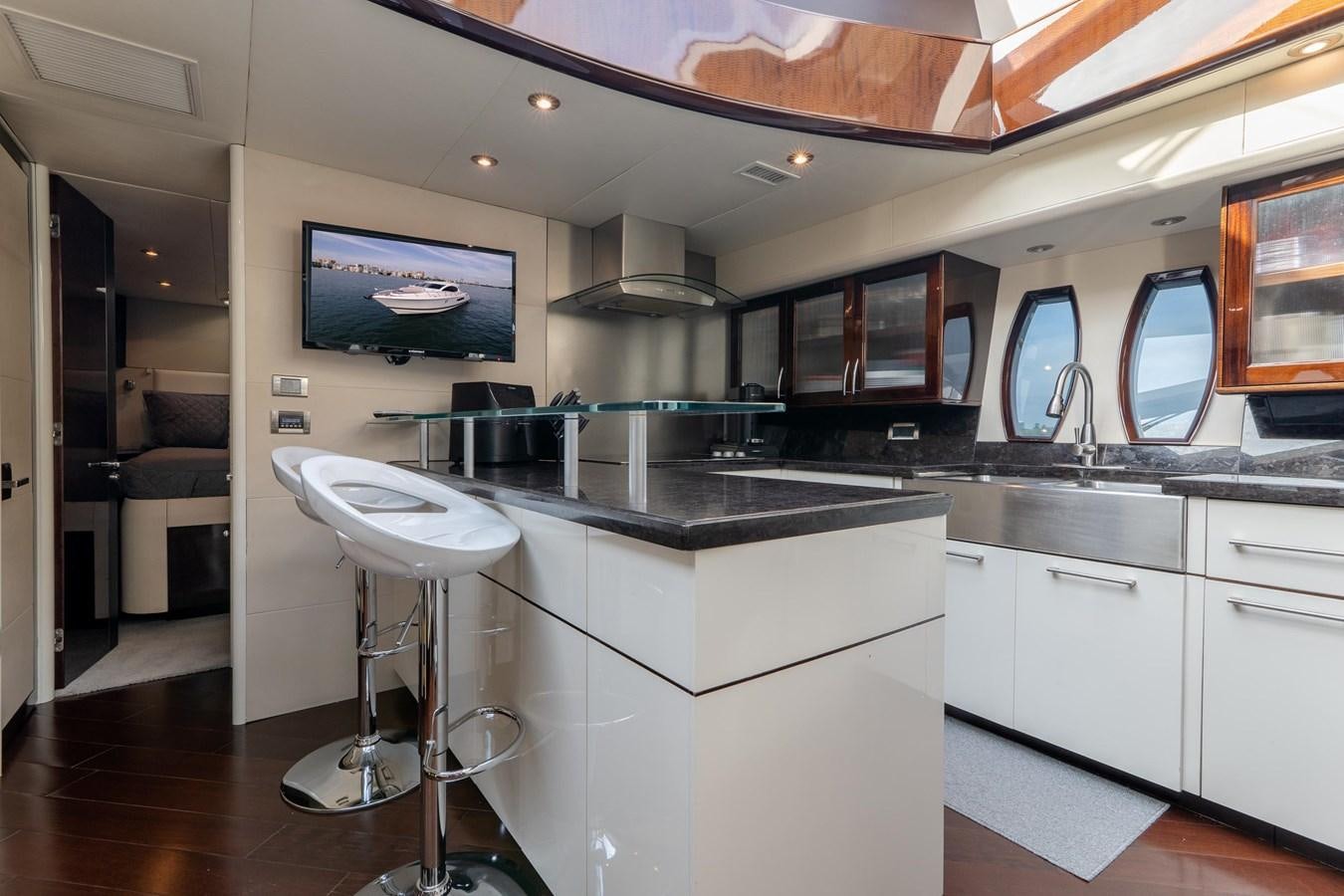 a kitchen with a large island aboard SALACIA Yacht for Sale