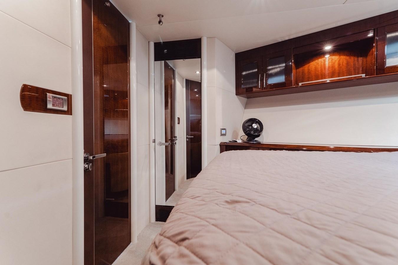 a bedroom with a bed and a closet aboard SALACIA Yacht for Sale