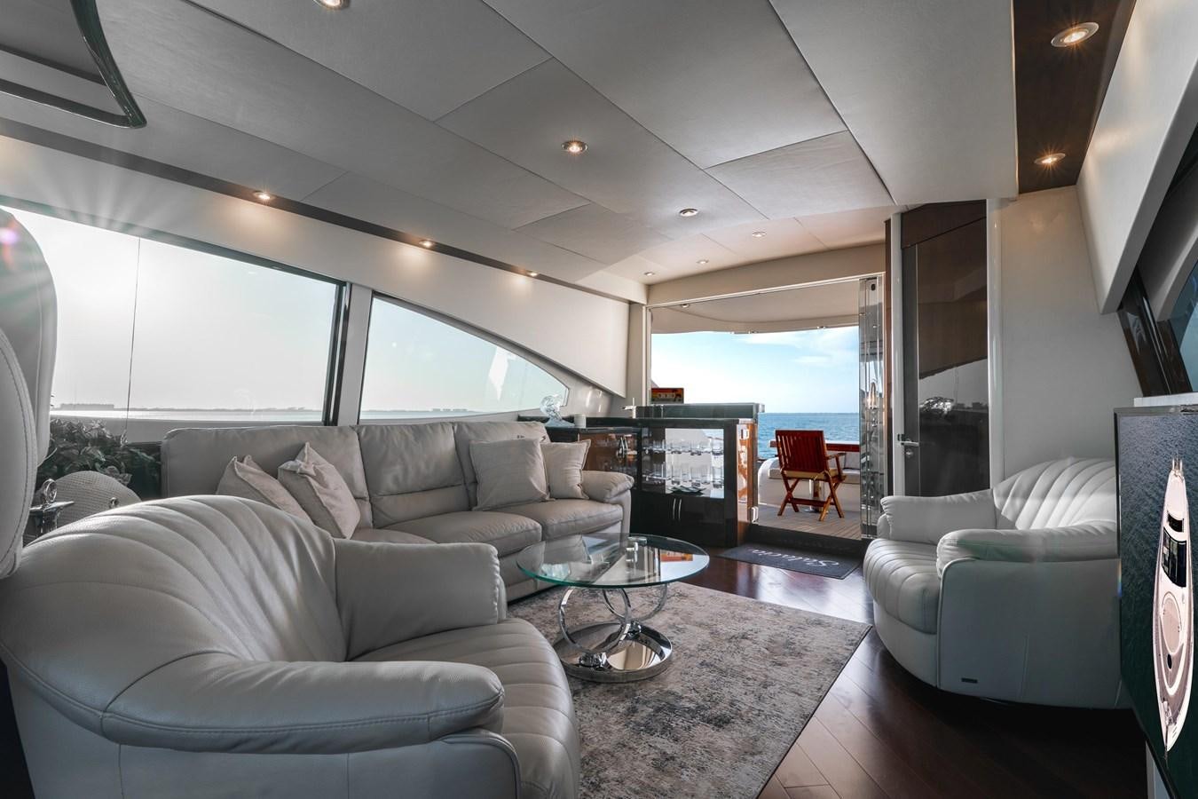 a living room with a large window aboard SALACIA Yacht for Sale