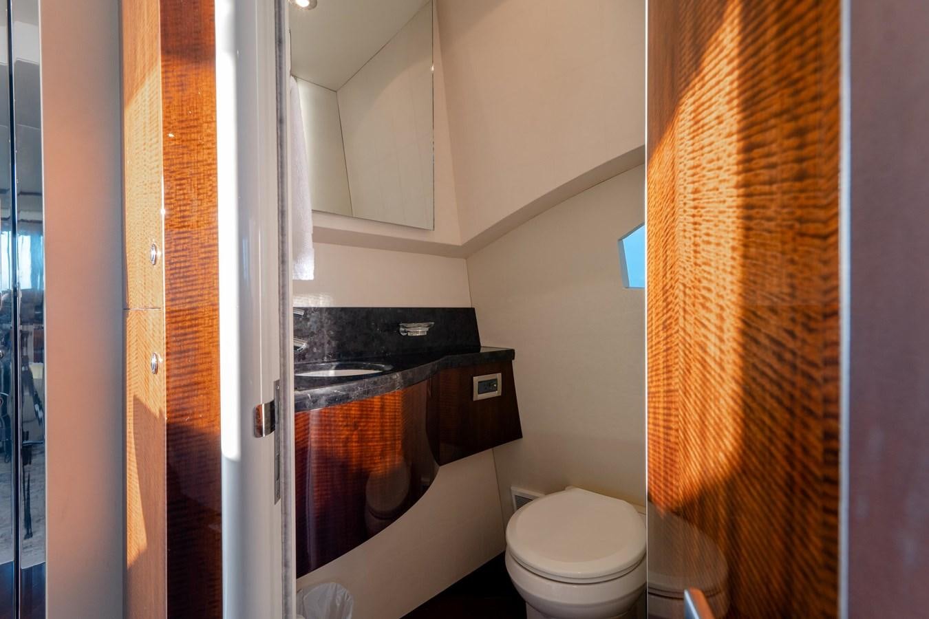 a bathroom with a toilet and a sink aboard SALACIA Yacht for Sale