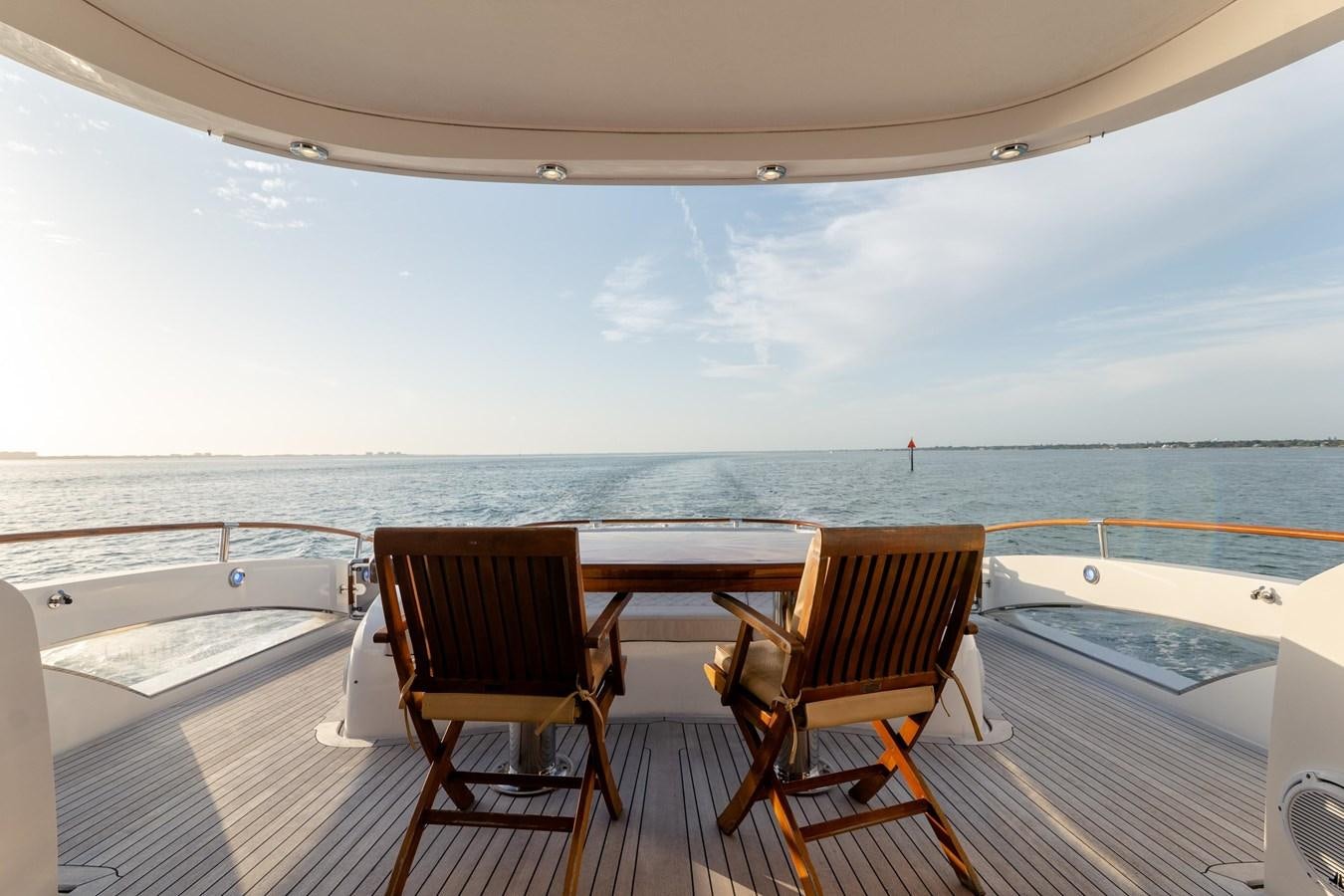 chairs on a deck overlooking the ocean aboard SALACIA Yacht for Sale