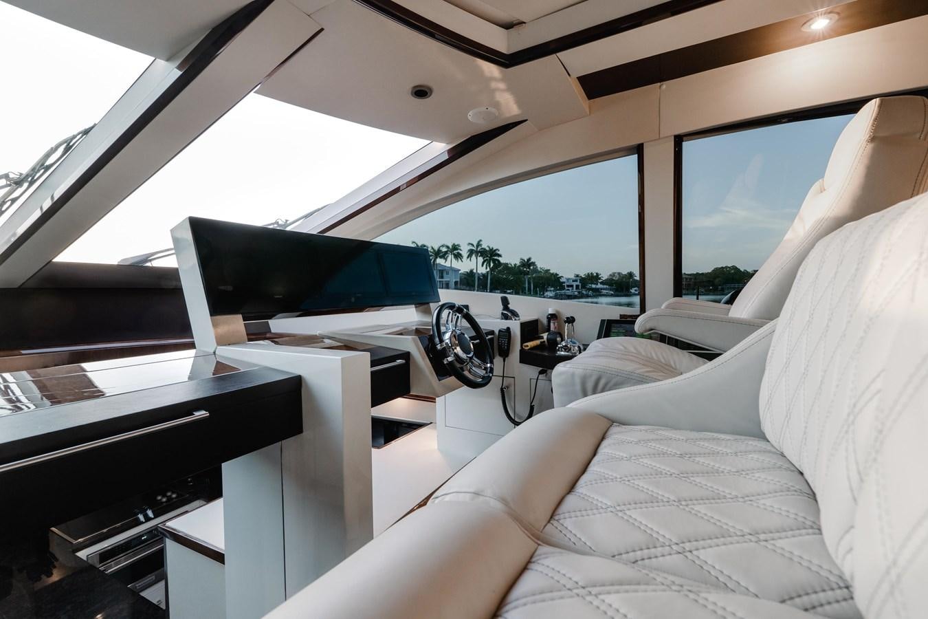 a white car with a black umbrella aboard SALACIA Yacht for Sale