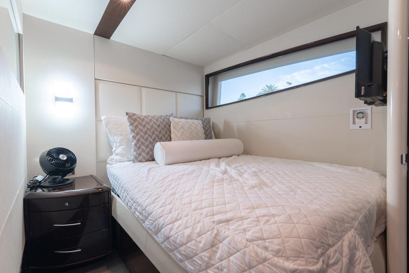 a bed with a white comforter aboard SALACIA Yacht for Sale