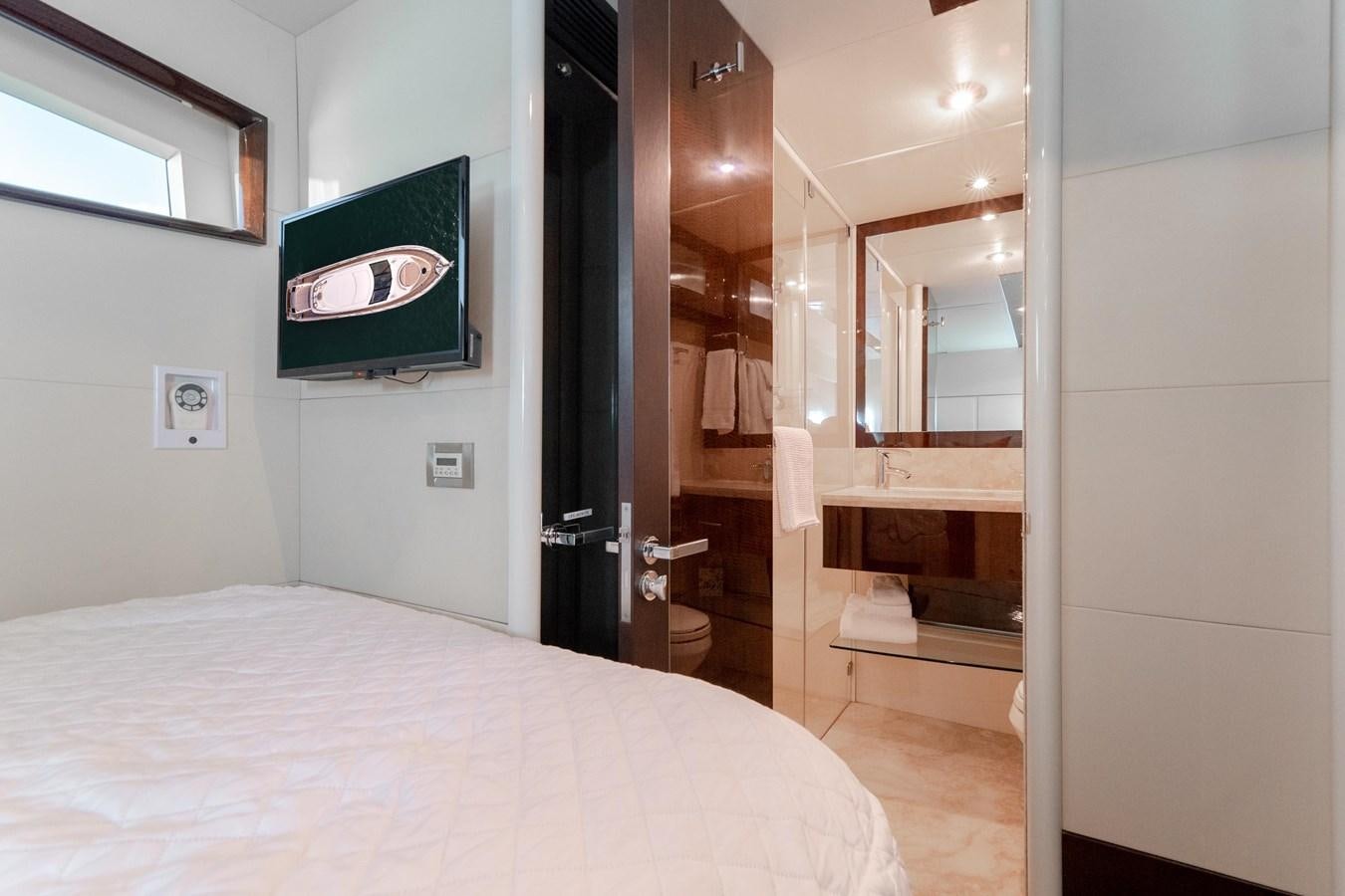 a room with a bed and a mirror aboard SALACIA Yacht for Sale