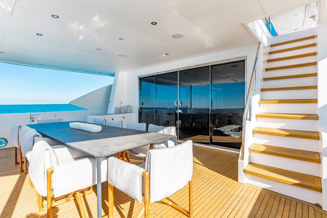 a room with a table and chairs aboard ADAGIO Yacht for Sale