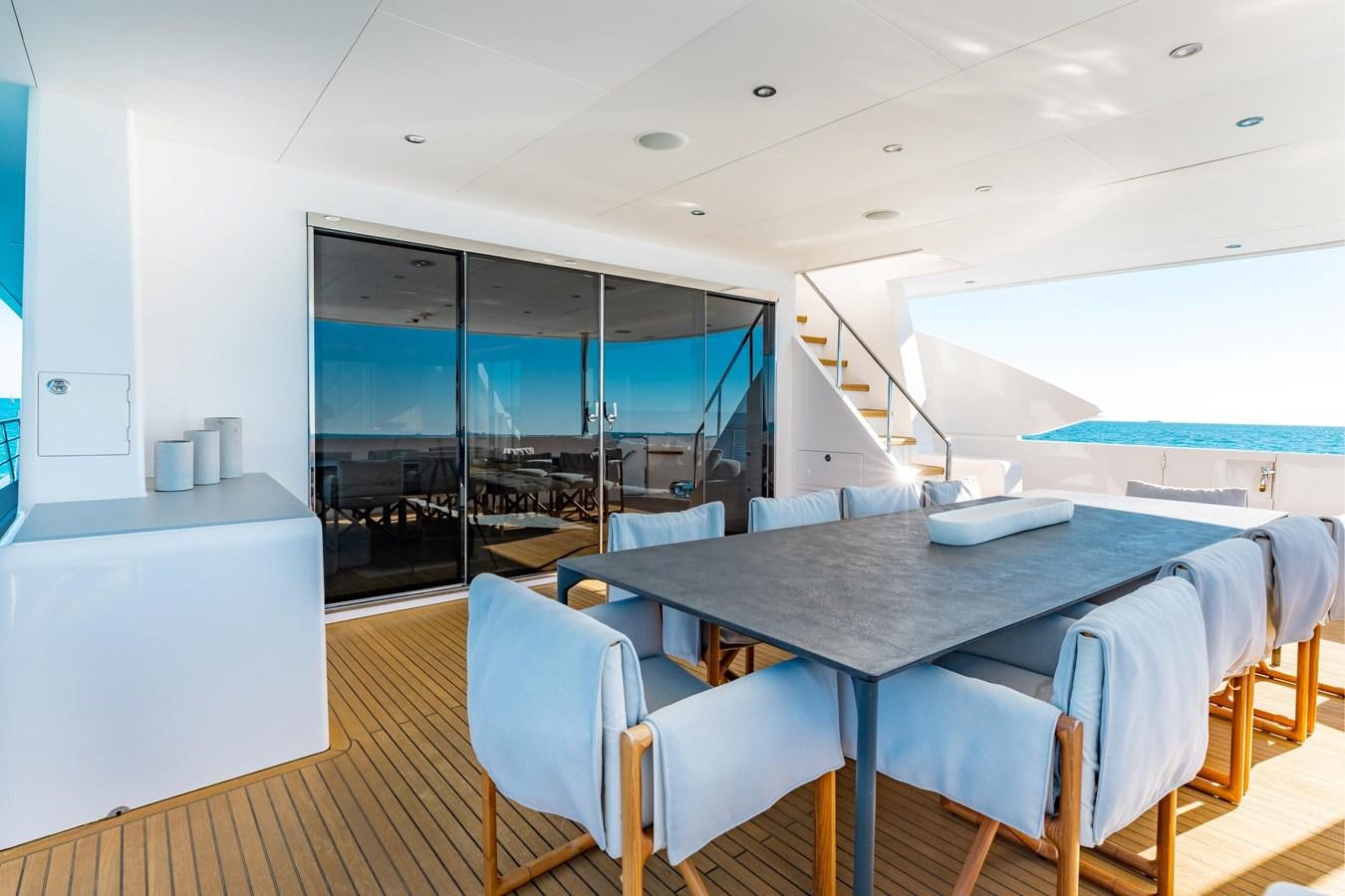 a room with a table and chairs aboard ADAGIO Yacht for Sale