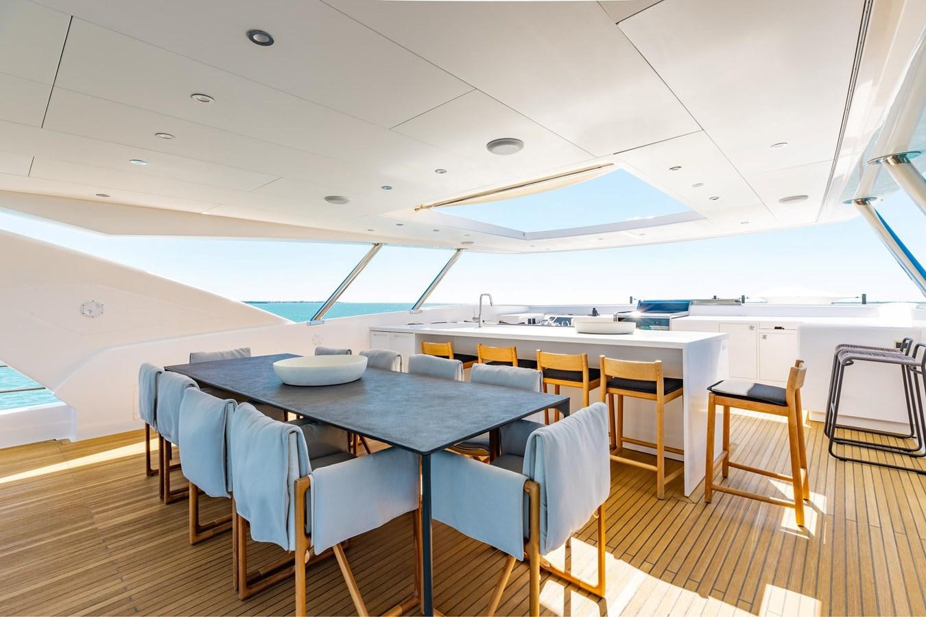 a kitchen with a table and chairs aboard ADAGIO Yacht for Sale