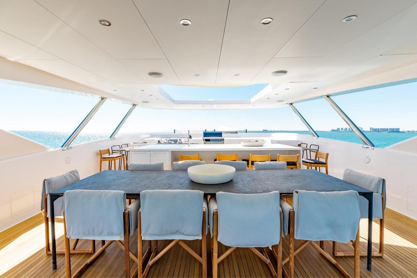 a large room with a table and chairs aboard ADAGIO Yacht for Sale