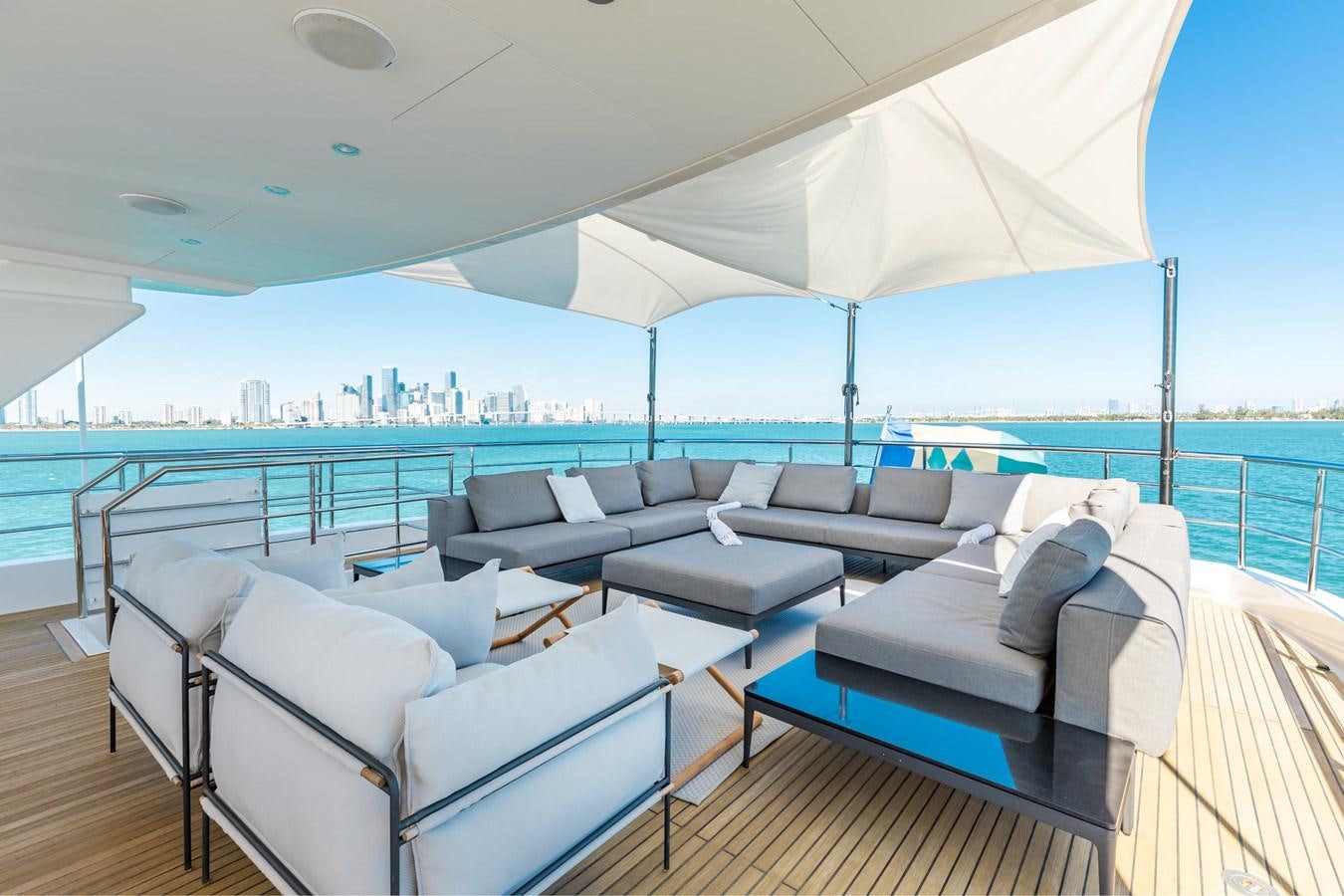 a large living room with a large balcony overlooking the ocean aboard ADAGIO Yacht for Sale