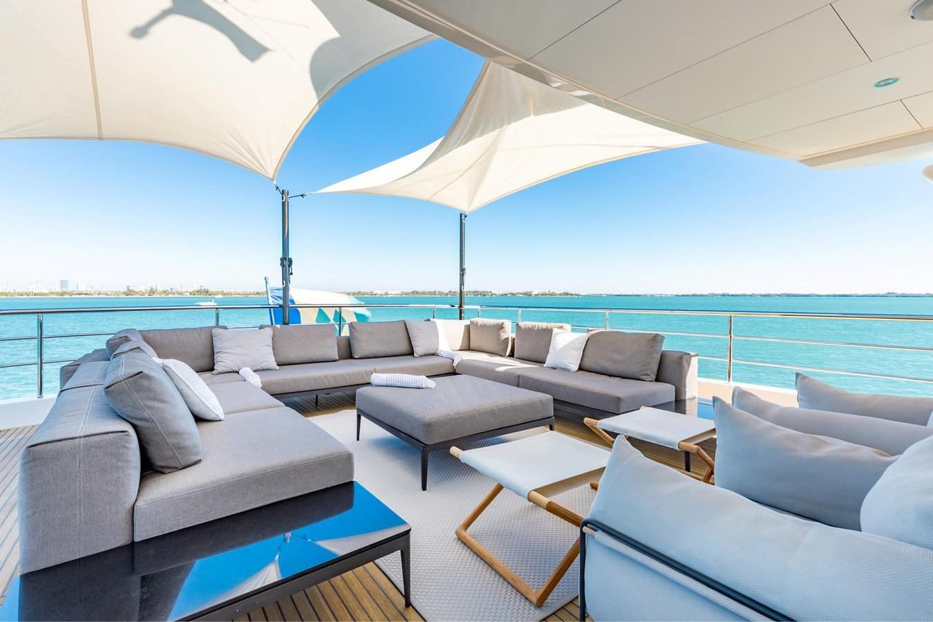 a large living room with a large ocean view aboard ADAGIO Yacht for Sale