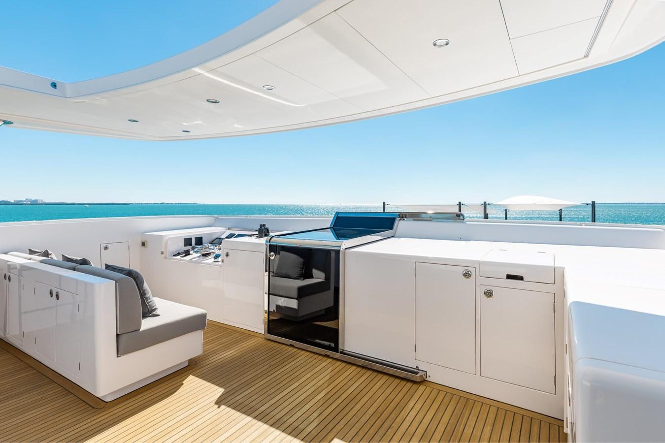a room with a large deck and a large pool aboard ADAGIO Yacht for Sale