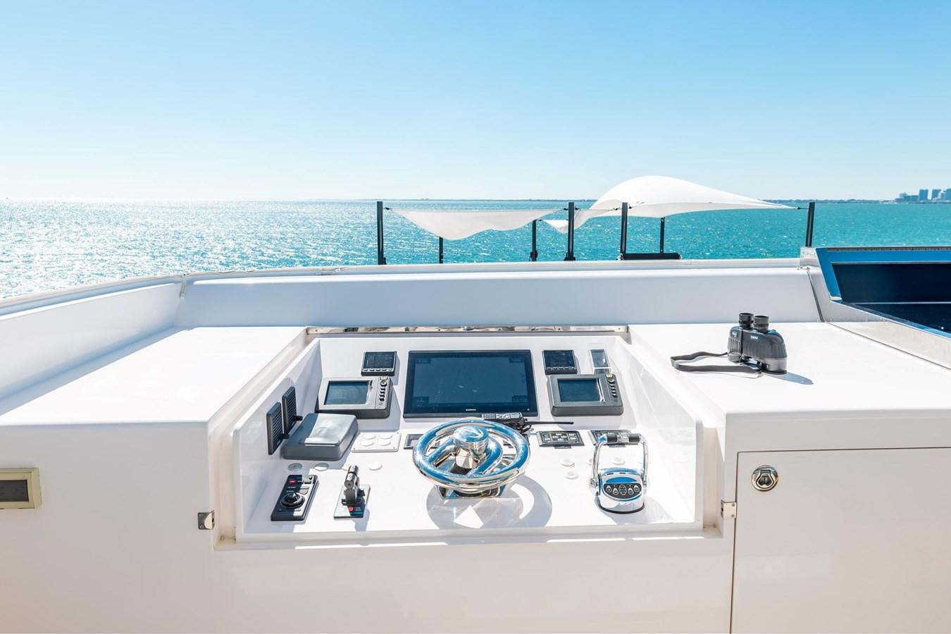 a white boat with a laptop on it aboard ADAGIO Yacht for Sale