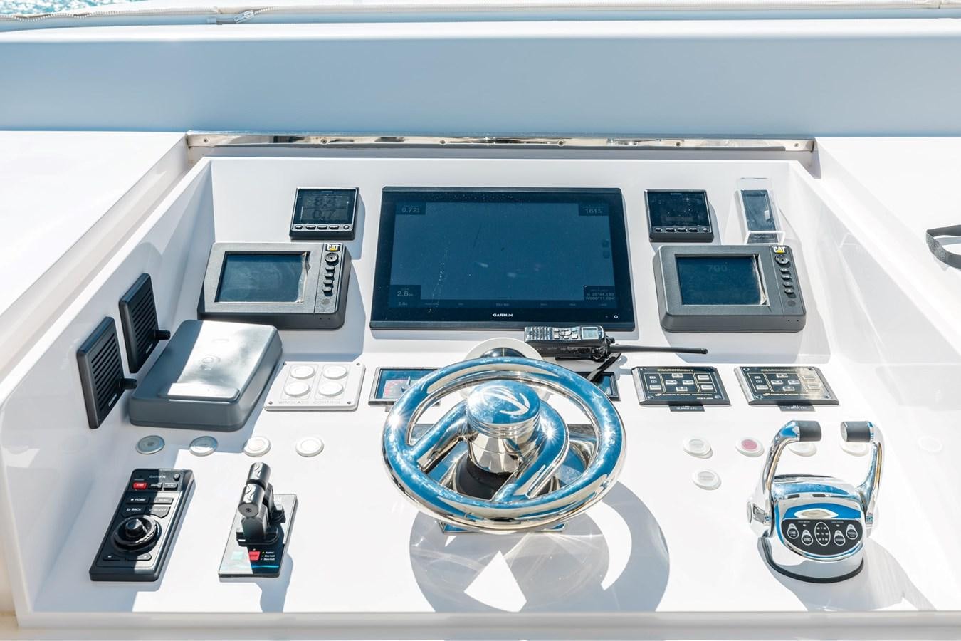 a computer with a blue circle and a white background aboard ADAGIO Yacht for Sale