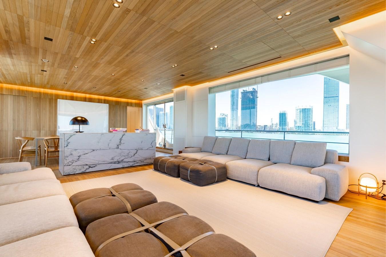 a living room with a large window aboard ADAGIO Yacht for Sale