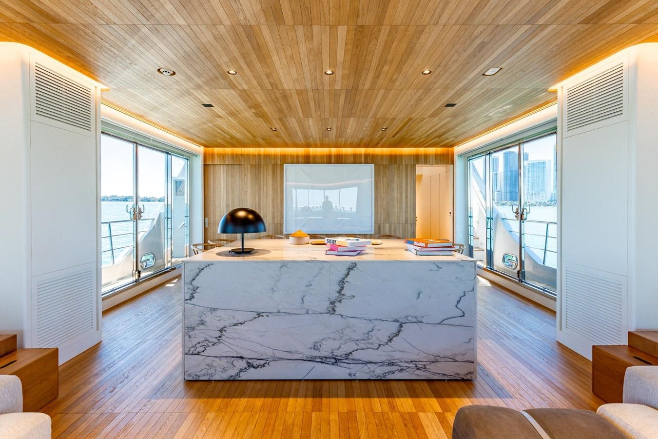 a large room with a large table aboard ADAGIO Yacht for Sale