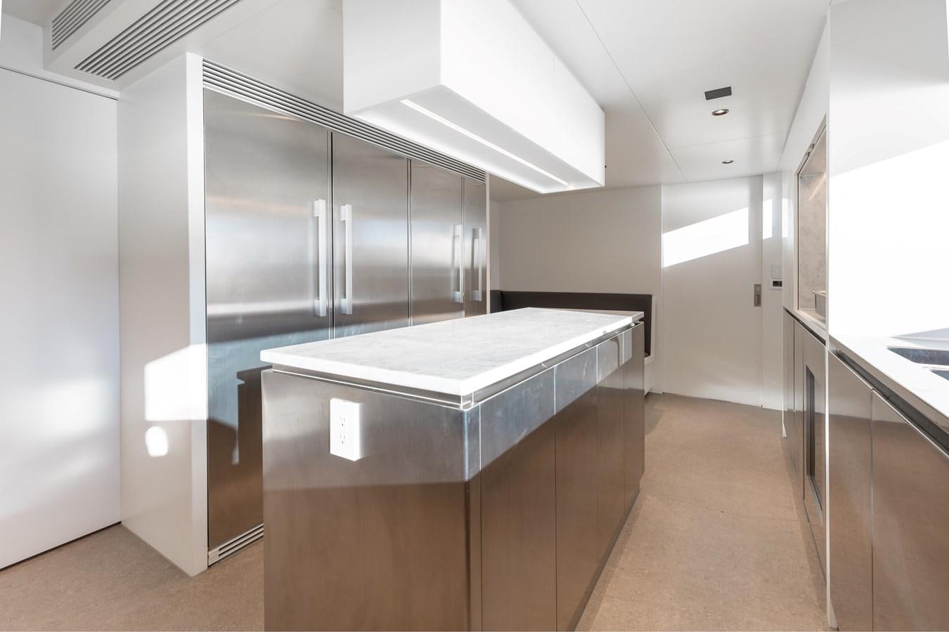 a large room with a large glass wall and a large stainless steel refrigerator aboard ADAGIO Yacht for Sale