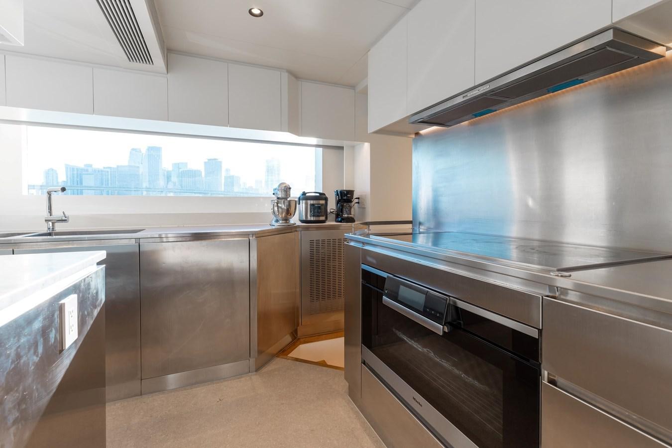 a kitchen with stainless steel appliances aboard ADAGIO Yacht for Sale